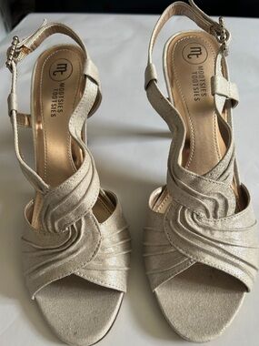 Champagne Twisted Strap Slingback Heels with sparkling rhinestone buckles.